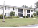 Front view of building showcasing manicured lawn at 711 Springer Dr # 2, Lake Wales, FL 33853