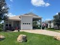 House exterior with a paver driveway and landscaping at 336 Cruisers Dr, Polk City, FL 33868