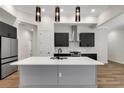 Modern kitchen with stainless steel appliances and large island at 5405 Delphi Hills Cir, Lakeland, FL 33812