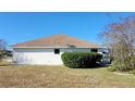 Rear view of a single-story house with a well-maintained lawn at 4773 Nw 32Nd St, Ocala, FL 34482