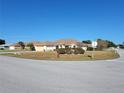 House exterior view showing a single story home on a corner lot with landscaping at 4773 Nw 32Nd St, Ocala, FL 34482