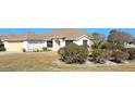 Single story home with attached garage, well maintained landscaping, and a light-colored facade at 4773 Nw 32Nd St, Ocala, FL 34482