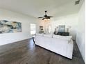 Living room with neutral decor, hardwood floors, and view of the front entryway at 2870 Stonewood Cir, Lakeland, FL 33810