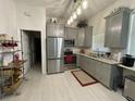 Modern kitchen with stainless steel appliances and granite countertops at 336 Motorcoach S Dr, Polk City, FL 33868