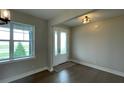 Bright and airy entryway with hardwood floors and natural light at 532 Adams View Ln, Auburndale, FL 33823