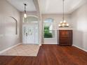 Bright dining room with hardwood floors and a chandelier at 988 Classic View Dr, Auburndale, FL 33823