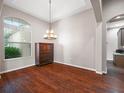 Spacious dining area featuring hardwood floors and an elegant chandelier at 988 Classic View Dr, Auburndale, FL 33823