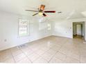 Simple living room with tile floors and ceiling fan at 1133 N Swindell Ave, Lakeland, FL 33805