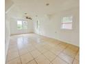 Simple living room with tile floors and ceiling fan at 1133 N Swindell Ave, Lakeland, FL 33805