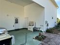 Carport with exterior door and storage cabinet at 1214 Motorcoach Dr, Polk City, FL 33868