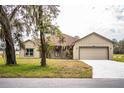 Charming one-story house with a tree-lined street and spacious front yard at 3671 E Gaskins Rd, Bartow, FL 33830