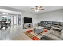 Spacious living room featuring a sectional sofa and large TV at 724 Hillside Ave, Lake Wales, FL 33853