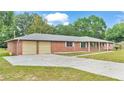 Brick ranch home with attached two car garage at 3479 Arrowwood Dr, Lakeland, FL 33811