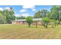Brick ranch home with a large front yard at 3479 Arrowwood Dr, Lakeland, FL 33811