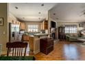 Open kitchen with breakfast bar, stainless steel appliances, and view of living room at 6118 Silver Lakes W Dr, Lakeland, FL 33810