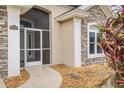 Inviting entryway with a screened porch at 8288 Lake James Dr, Lakeland, FL 33810