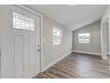 Bright entryway with hardwood floor and windows at 401 Sw 1St Ave, Mulberry, FL 33860