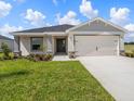 One-story home with attached garage and front yard at 2097 Summerlake Dr, Auburndale, FL 33823