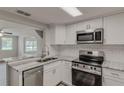 Renovated kitchen featuring granite countertops and stainless steel appliances at 2531 Hebb Rd, Auburndale, FL 33823