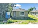 Newly built small single-Gathering home with a tan exterior at 1033 Lakewood Ct, Lakeland, FL 33801