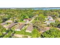 Aerial view of homes and properties near a lake at 1033 Lakewood Ct, Lakeland, FL 33801