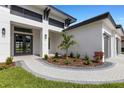 Landscaped walkway leading to front entrance at 1969 Grasslands Blvd, Lakeland, FL 33803