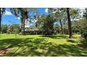 Brick ranch house on a large lot with lush green lawn at 7520 Kathleen Rd, Lakeland, FL 33810