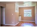 Dining area with hardwood floors, and a view into the kitchen at 526 3Rd Ne St, Fort Meade, FL 33841