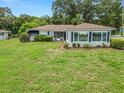 Single story home with large backyard and mature trees at 1342 W Lake Parker Dr, Lakeland, FL 33805