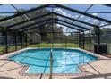 Inviting screened-in pool with brick pavers at 2508 Providence Rd, Lakeland, FL 33805