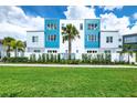 Modern three-story building with blue and white accents at 7770 Sandy Ridge Dr # 115, Reunion, FL 34747
