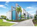 Modern three-story building with blue and white accents at 7770 Sandy Ridge Dr # 115, Reunion, FL 34747