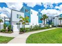 Modern three-story building with blue and white accents at 7770 Sandy Ridge Dr # 115, Reunion, FL 34747