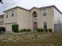Two-story house with attached garage at 600 Sunway Ln, Winter Haven, FL 33880