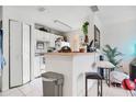 Efficient kitchen with white cabinets and appliances at 4255 Summer Landing Dr # 106, Lakeland, FL 33810