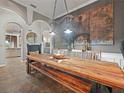 Rustic dining room with a large wooden table and decorative wall art at 1096 Drew St, Lakeland, FL 33810