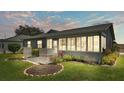 Enclosed patio area with landscaping and lighting at 5956 Chickadee Dr, Lakeland, FL 33809