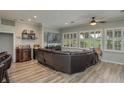 Gathering room with a large sectional sofa and flat screen tv at 6803 Hermitage Dr, Lakeland, FL 33810