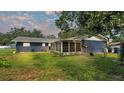 Spacious backyard with screened porch and fenced area at 1206 Price Ave, Auburndale, FL 33823