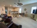 Living room with comfortable seating and access to kitchen at 323 Travelers Dr, Polk City, FL 33868
