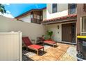 Relaxing patio with lounge chairs, perfect for outdoor enjoyment at 103 Coventry Ln, Haines City, FL 33844