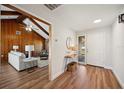 Bright and airy entryway with hardwood floors, leading to living room at 4500 Old Colony Rd, Mulberry, FL 33860