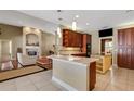 Open kitchen with breakfast bar and view to Gathering room at 6529 Longwood Trace S Ln, Lakeland, FL 33811