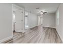Open living room with hardwood floors and access to bathroom at 2529 Weber St, Lakeland, FL 33801