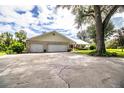 Three-car garage with ample parking space at 310 Willow Oak Ct, Fort Meade, FL 33841