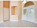 Bright and spacious entryway with double doors and tile flooring at 2948 Vintage View Cir, Lakeland, FL 33812