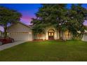 Two-story house with a large front yard and double door entry at 2948 Vintage View Cir, Lakeland, FL 33812