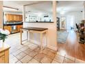 Open kitchen with wood cabinets, granite countertops, and stainless steel appliances at 2036 E Gachet Blvd, Lakeland, FL 33813
