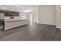 Open concept kitchen with island and dark cabinetry at 568 Sw 77Th Cir, Ocala, FL 34480