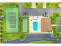 Community features tennis court, pool, shuffleboard, and parking at 480 Nighthawk Dr, Lakeland, FL 33813